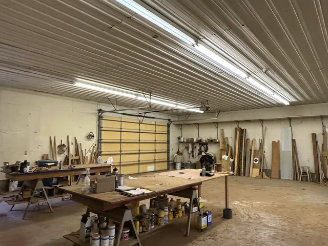 a view of a big room with table and chairs