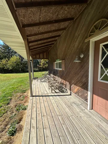 a view of balcony with a swimming pool