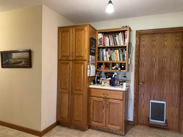 a view of a livingroom with shelves