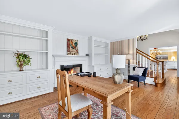 a spacious bedroom with a bed and a chair