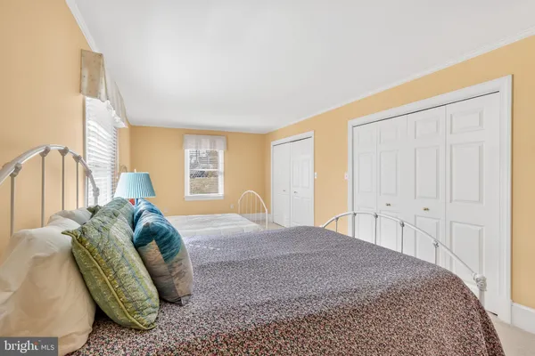 a bathroom with a double vanity sink mirror and shower