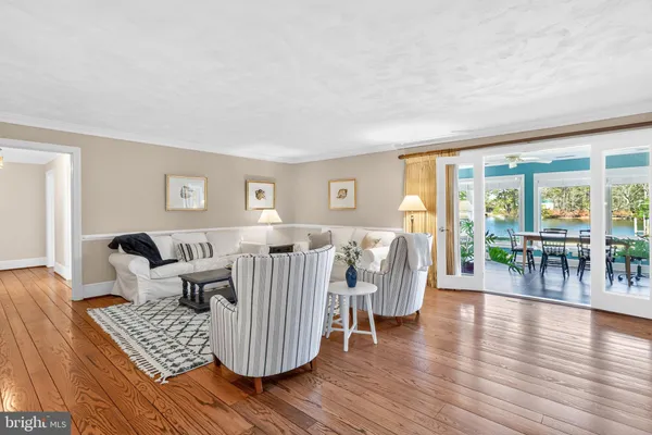 a kitchen with stainless steel appliances granite countertop a sink stove and wooden floor