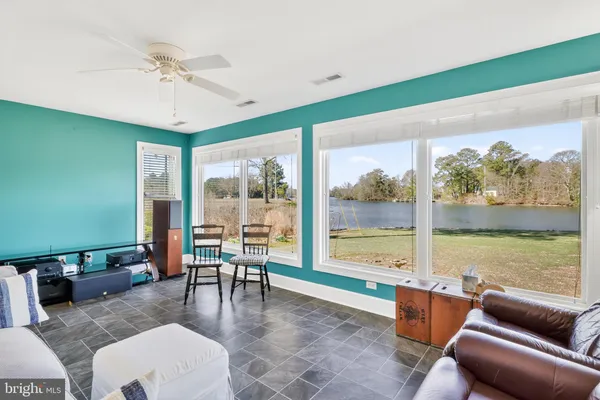 a view of a dining room with furniture and window