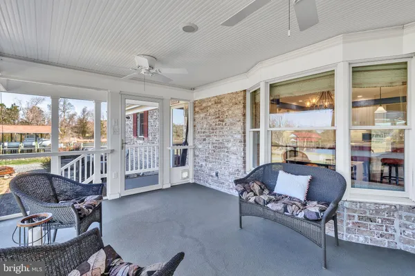 a en suite bathroom with a sink mirror and a shower