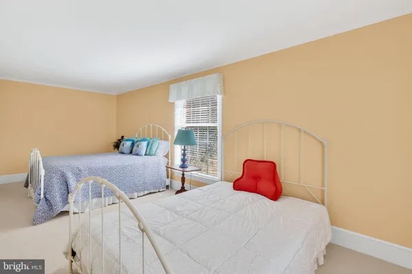 an aerial view of a house with garden space and lake view