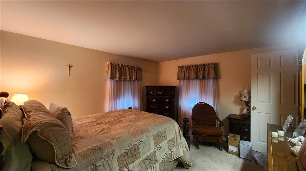 525 Burns Street Vandergrift, PA 15690 - Photo 12 of 25 a bedroom with a bed couch and a closet