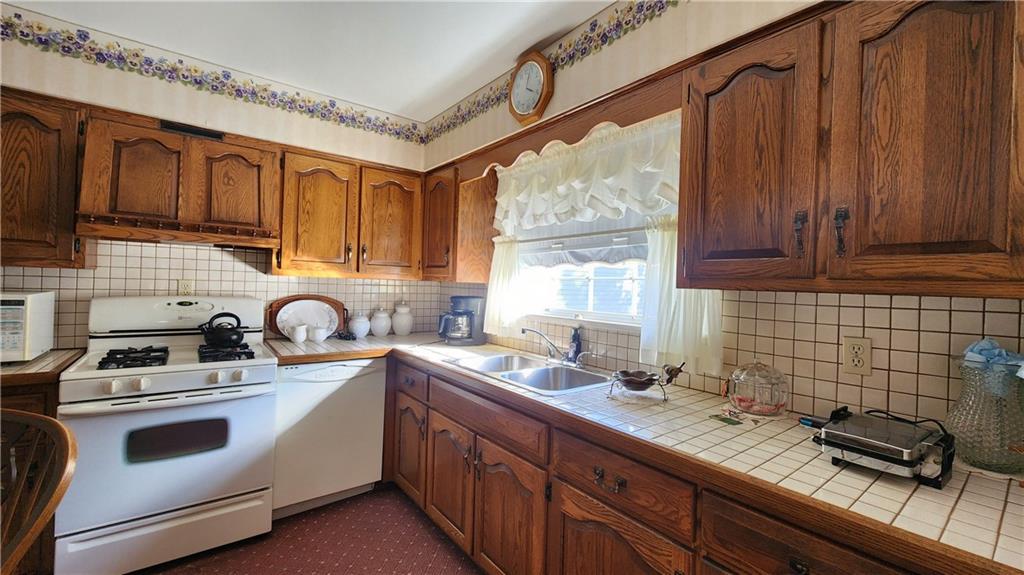 525 Burns Street Vandergrift, PA 15690 - Photo 7 of 25 a kitchen with sink a stove and cabinets