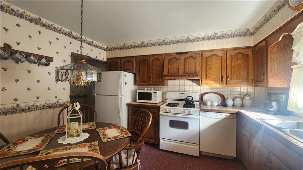 525 Burns Street Vandergrift, PA 15690 - Photo 8 of 25 a kitchen with stainless steel appliances a stove a sink a refrigerator and cabinets