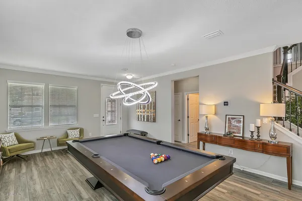a living room with furniture rug and window