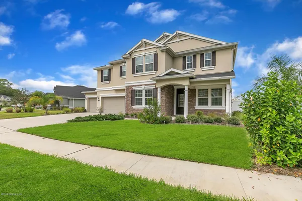 a front view of a house with a yard