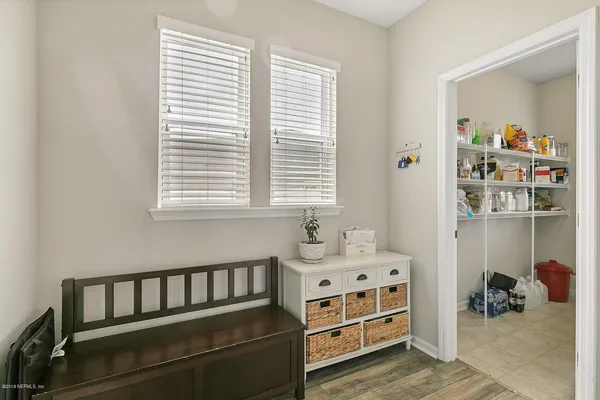 a bedroom with furniture and a window