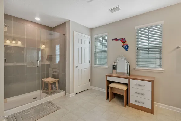 a bathroom with a sink and a shower