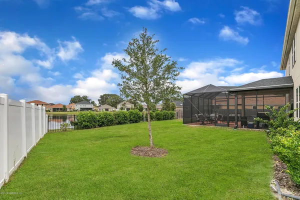 a garden with trees in front of it