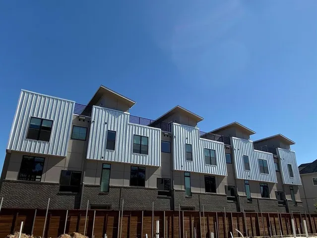 a bathroom with a double vanity sink mirror and shower