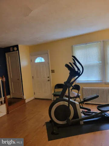 a room with gym equipment and mirrors