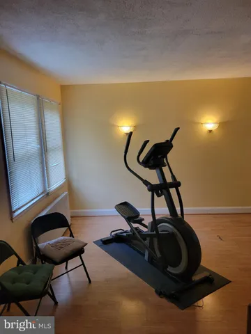 a room with furniture and wooden floor