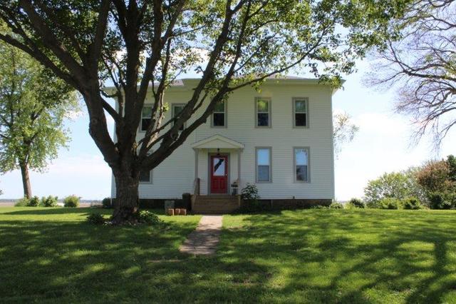 19567 Mathew Road Morrison, IL 61270 - Photo 1 of 62 a front view of a house with a garden