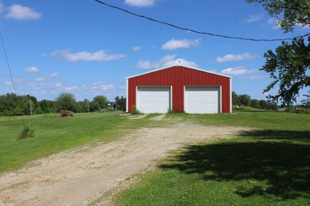 19567 Mathew Road Morrison, IL 61270 - Photo 13 of 62 a front view of a house with a yard