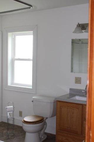 19567 Mathew Road Morrison, IL 61270 - Photo 21 of 62 a bathroom with a toilet sink and mirror