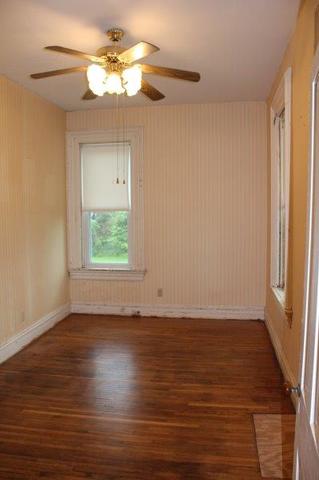 19567 Mathew Road Morrison, IL 61270 - Photo 34 of 62 a view of an empty room with wooden floor and a window