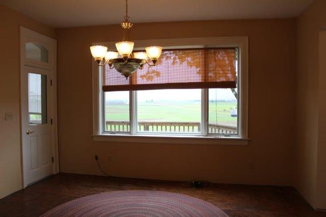 19567 Mathew Road Morrison, IL 61270 - Photo 46 of 62 a view of empty room with wooden floor and fan