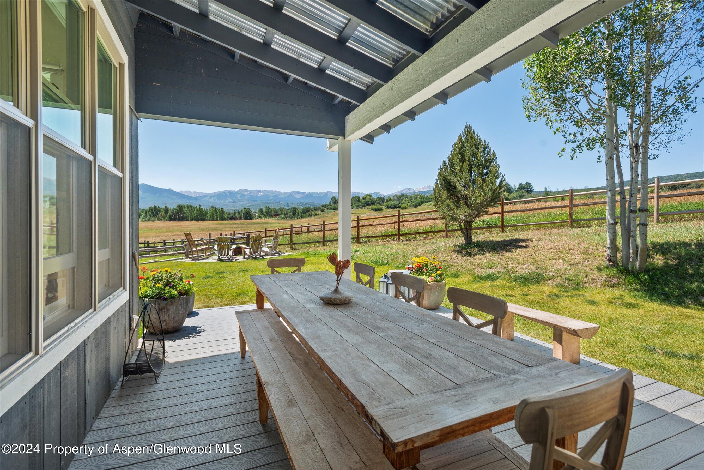 91 Alexander Avenue Snowmass, CO 81654 - Photo 11 of 32 a view of a balcony with lake view and a large window