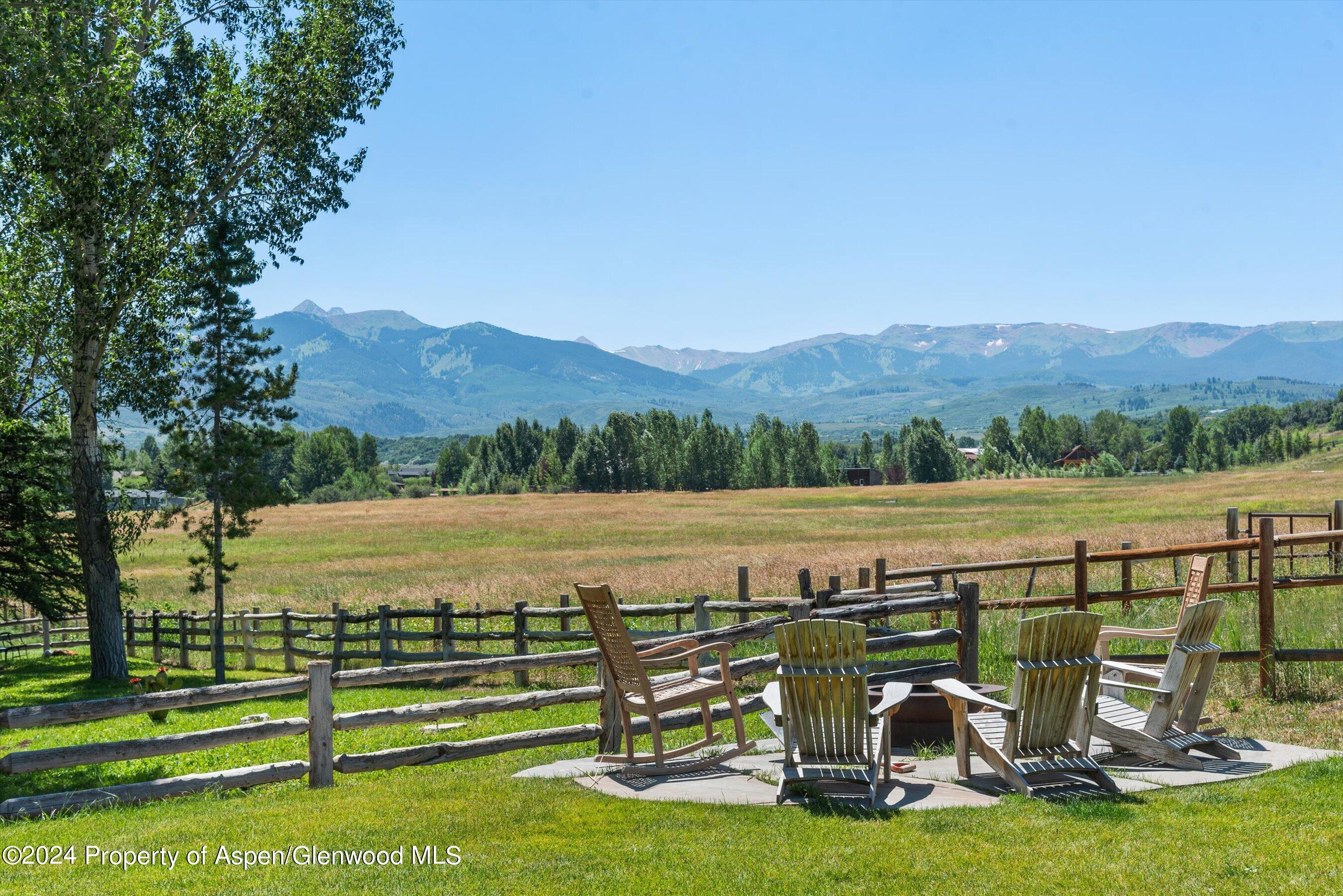 91 Alexander Avenue Snowmass, CO 81654 - Photo 13 of 32 a view of a lake with a mountain in the background