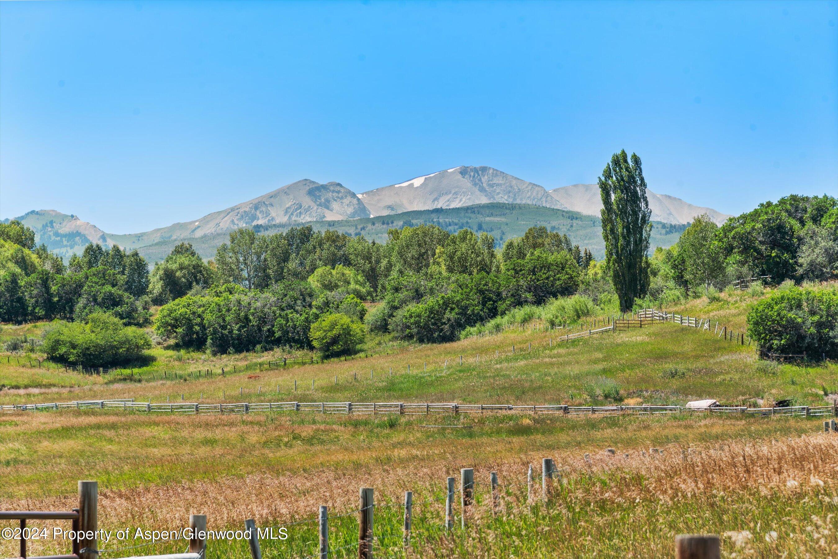 91 Alexander Avenue Snowmass, CO 81654 - Photo 14 of 32 a view of a lake with a mountain in the background
