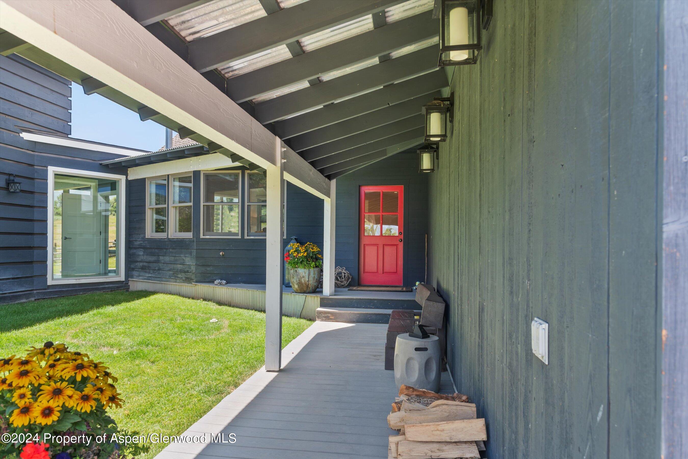91 Alexander Avenue Snowmass, CO 81654 - Photo 2 of 32 a front view of a house with a yard