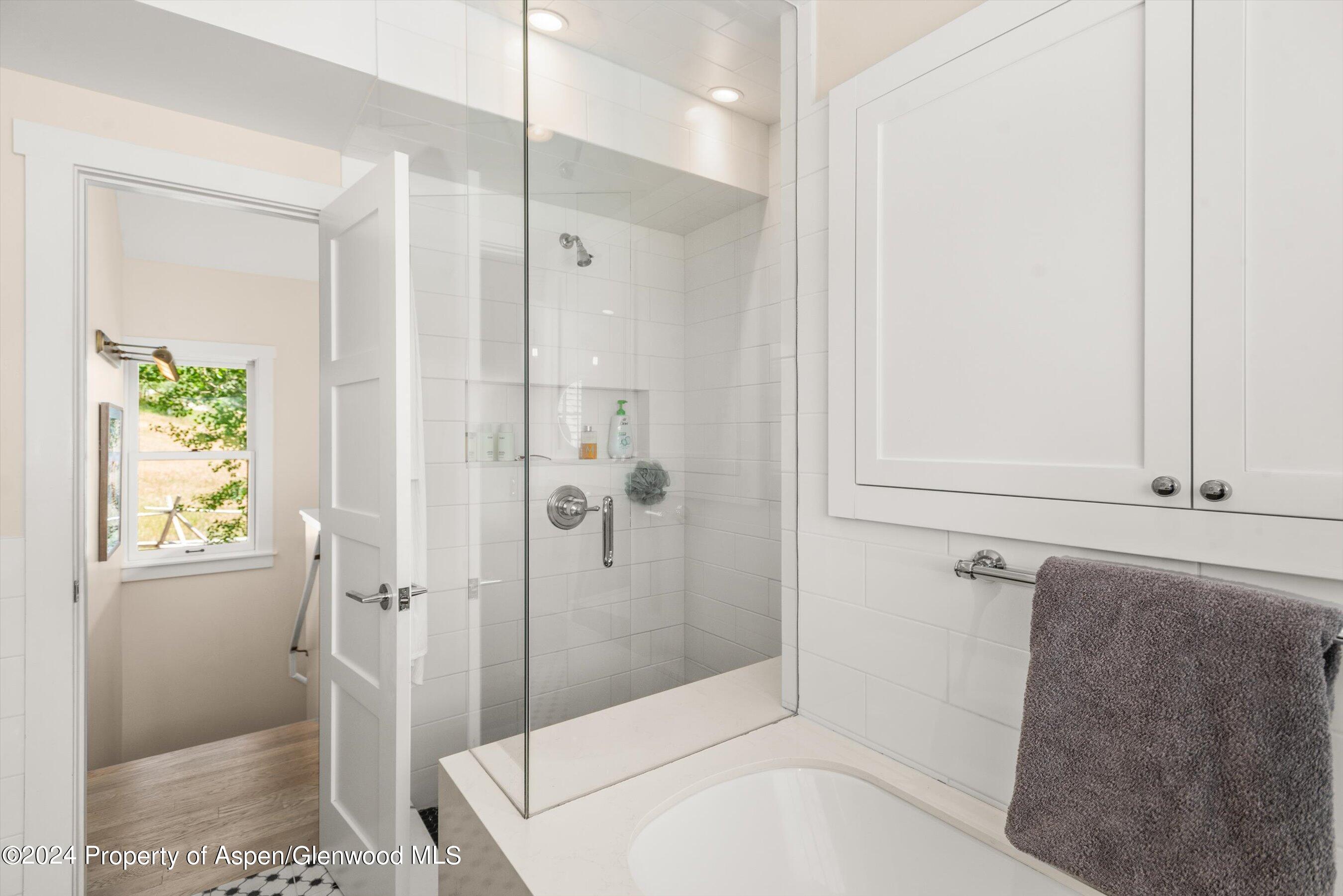 91 Alexander Avenue Snowmass, CO 81654 - Photo 29 of 32 a bathroom with a tub and shower