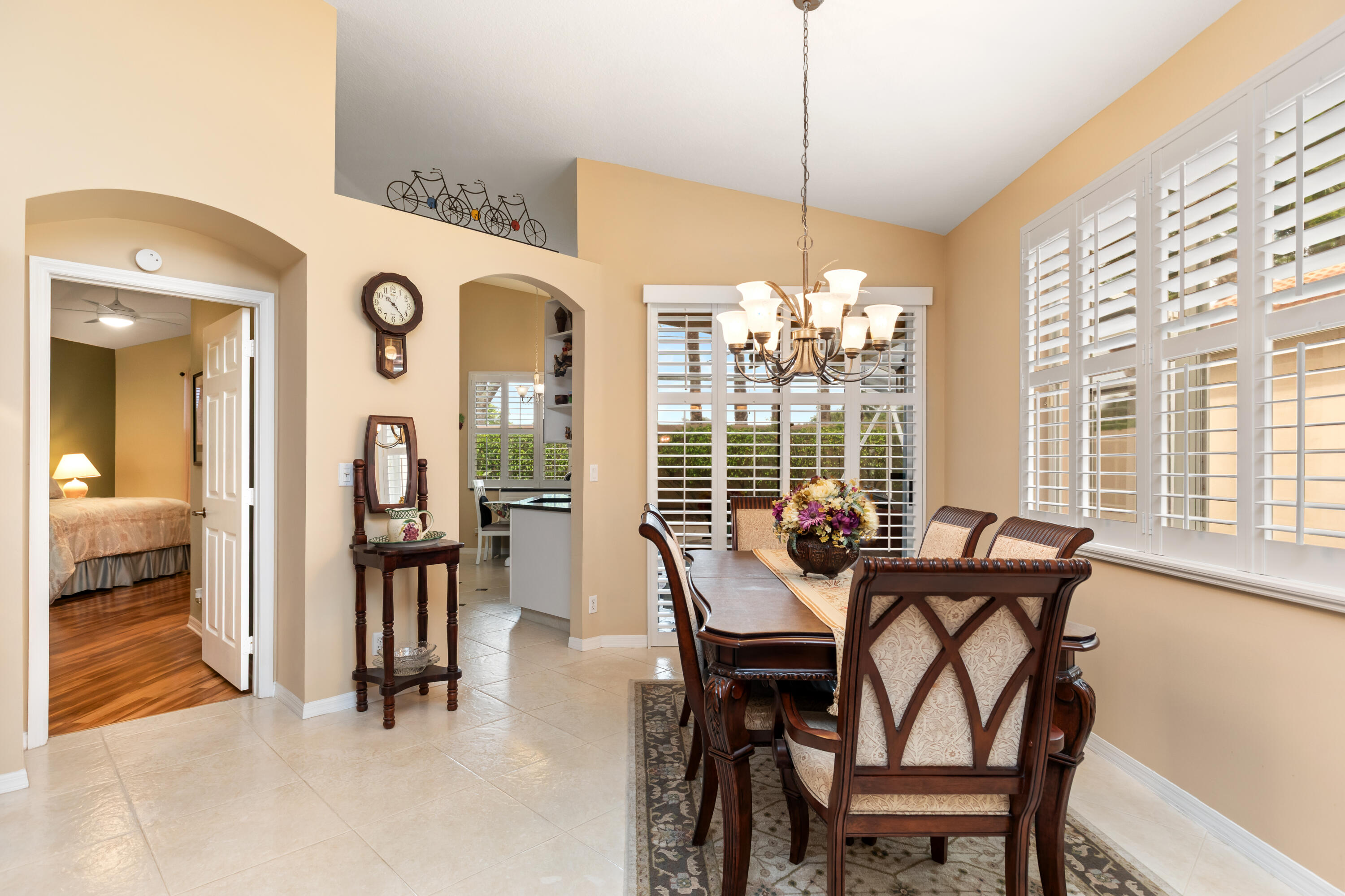6698 Vía Roma Delray Beach, FL 33446 - Photo 6 of 50 a view of a dining room with furniture and a chandelier