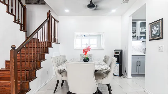 a view of entryway kitchen and hall with wooden floor