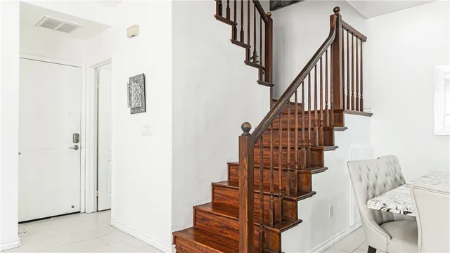 a view of an entryway with a table and chairs