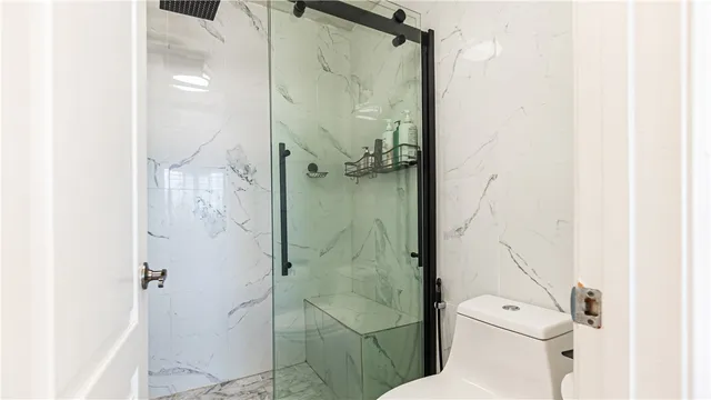 a view of a balcony with an outdoor seating