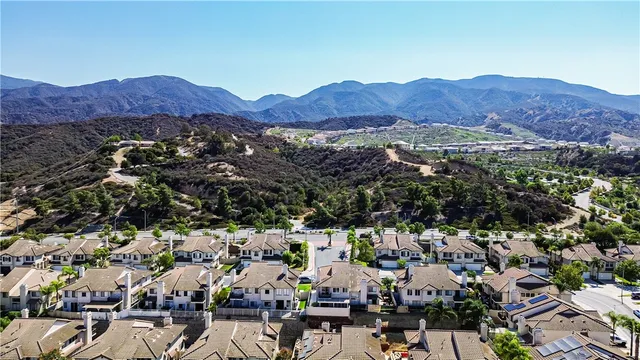 an aerial view of residential house and sandy dunes