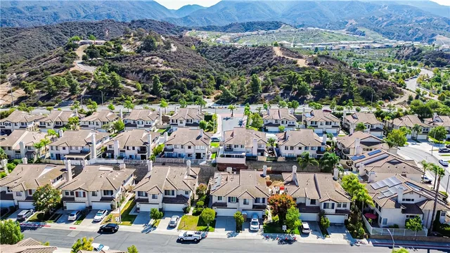 an aerial view of residential house and sandy dunes