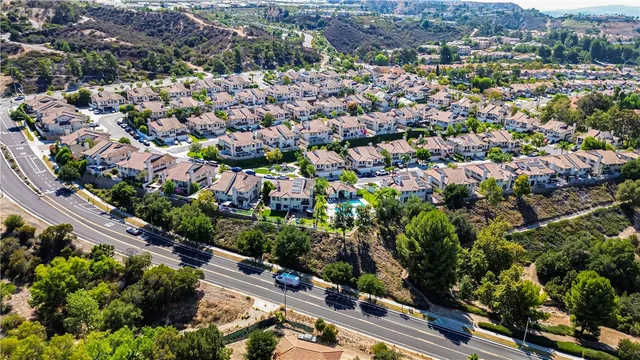 an aerial view of residential house and sandy dunes
