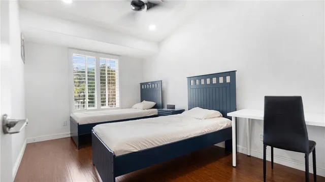 a bedroom with a bed and a chair