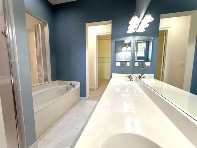 an aerial view of a house with a lake view