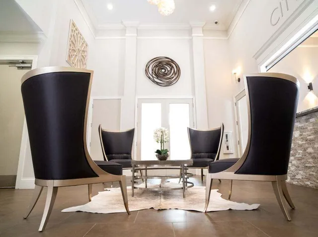 an aerial view of residential houses with outdoor space and lake view