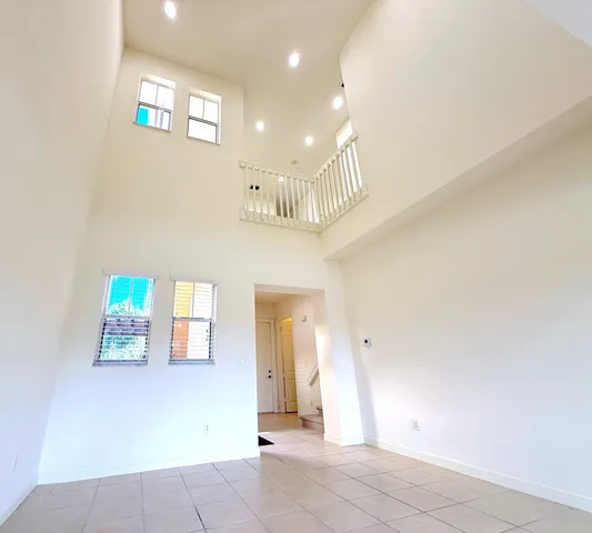 a view of a kitchen with a refrigerator and a stove