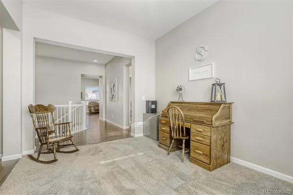 a room with table chairs and a dining table