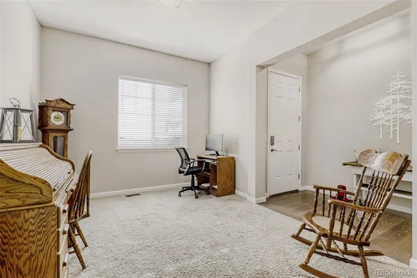 a bedroom with furniture and a window