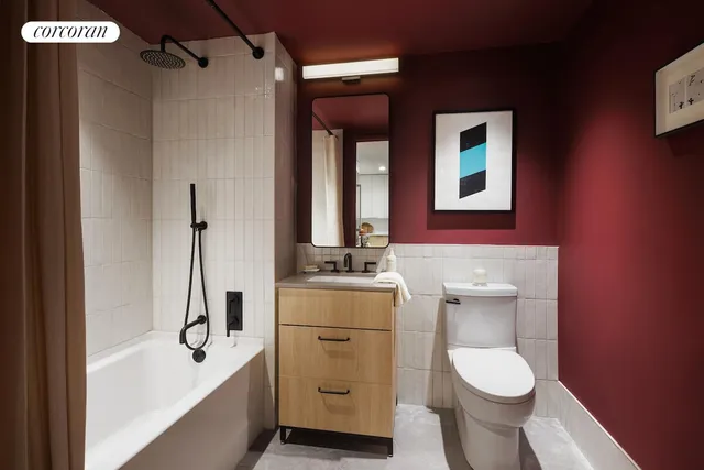 a bathroom with a granite countertop toilet sink and mirror