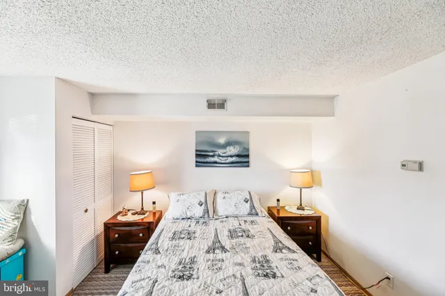 a bedroom with bed and window