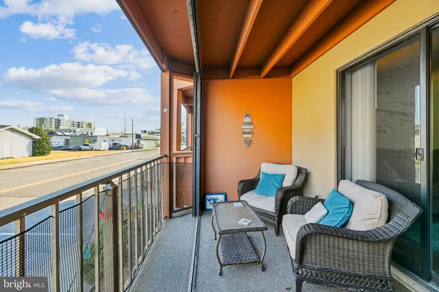 a balcony with furniture and city view