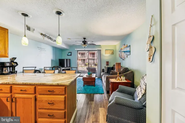 a view of a living room and kitchen