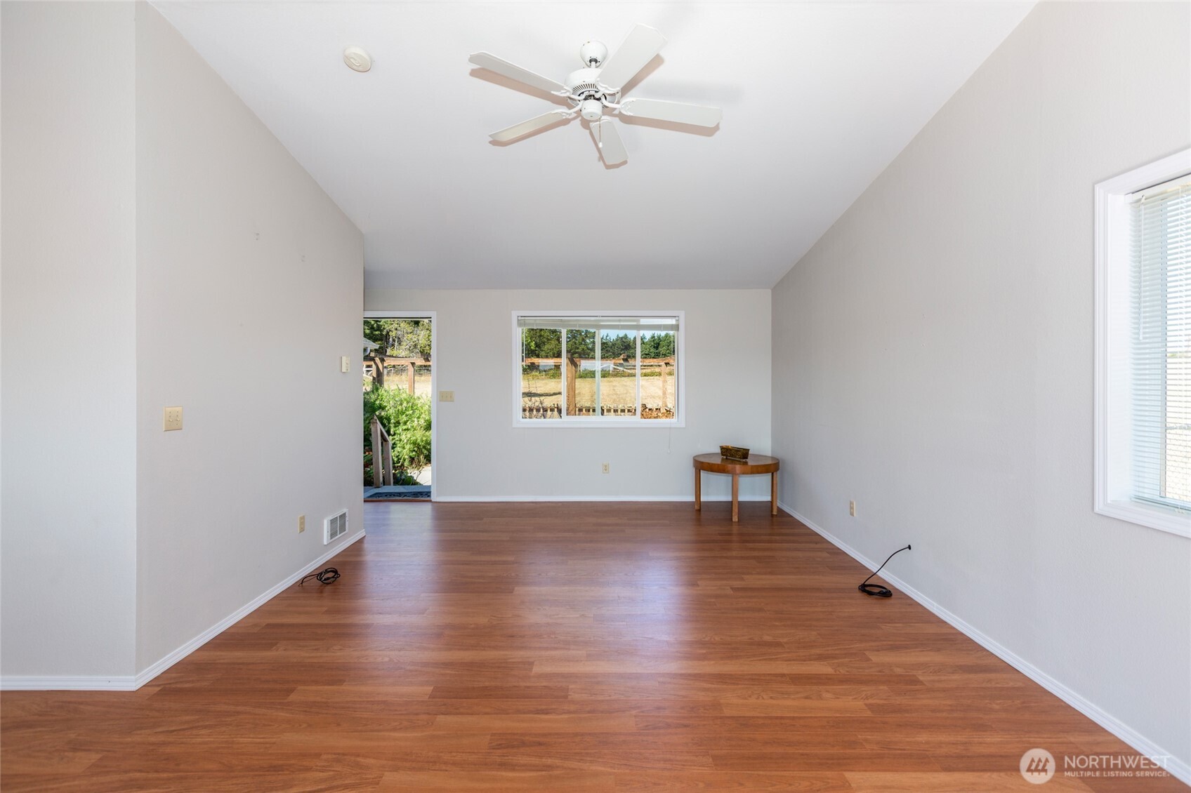 549 Davis Bay Road Lopez Island, WA 98261 - Photo 12 of 37 an empty room with window and a ceiling fan