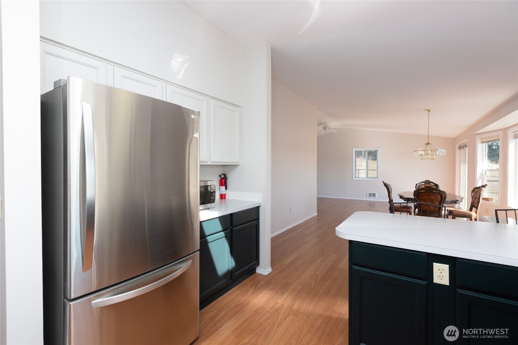 549 Davis Bay Road Lopez Island, WA 98261 - Photo 17 of 37 a kitchen with stainless steel appliances a refrigerator and a sink