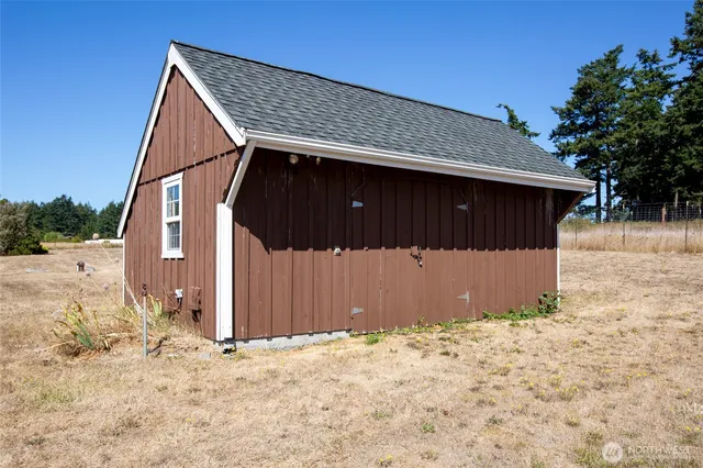 a view of a house with a yard and plants